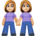 Facebook上的女性牵手：中浅肤色emoji表情
